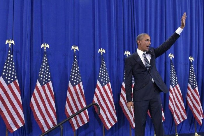 US President Barack Obama waves after speaking on counterterrorism in Tampa, Florida on December 6, 2016