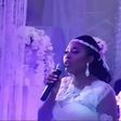 The singer doing what she loves doing at her wedding ceremony