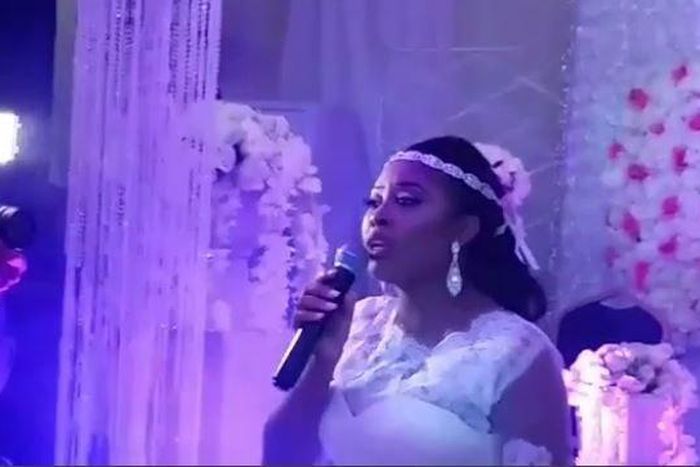 The singer doing what she loves doing at her wedding ceremony