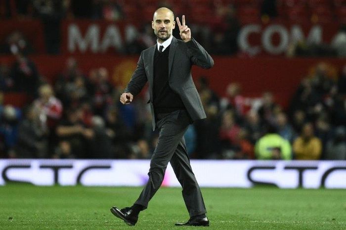 Manchester City's manager Pep Guardiola on the pitch after the English Football League Cup fourth round match between Manchester United and Manchester City at Old Trafford in Manchester, north west England on October 26, 2016
