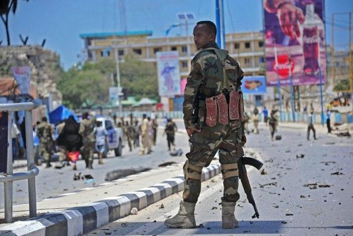 Somali security forces guard the site of a suicide blast in Mogadishu in August 2016