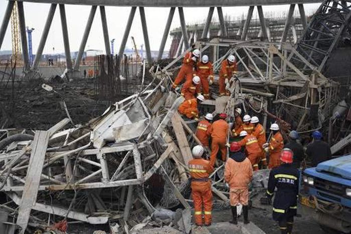 Rescue workers look for survivors after a work platform collapsed at the Fengcheng power plant in eastern China's Jiangxi Province.