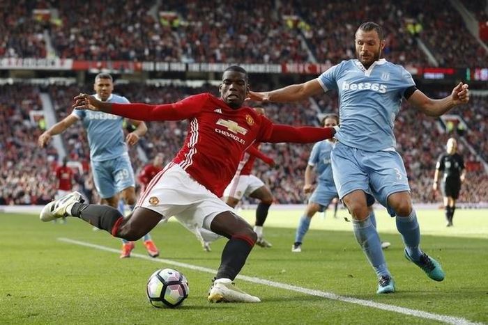 Stoke City's Erik Pieters in action with Manchester United's Paul Pogba