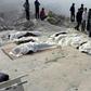 The covered bodies of dead miners lie near the site of a coal mine collapse near Lalmatia in Godda district, in eastern India's Jharkhand state on December 30, 2016