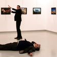 Andrei Karlov (front), the Russian ambassador to Ankara, lies on the floor next to his killer during an art exhibition in Ankara, on December 19, 2016