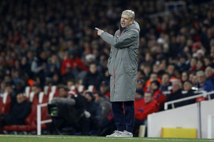 Arsenal's manager Arsene Wenger shouts instructions to his players from the touchline during the EFL (English Football League) Cup quarter-final football match between Arsenal and Southampton on November 30, 2016.