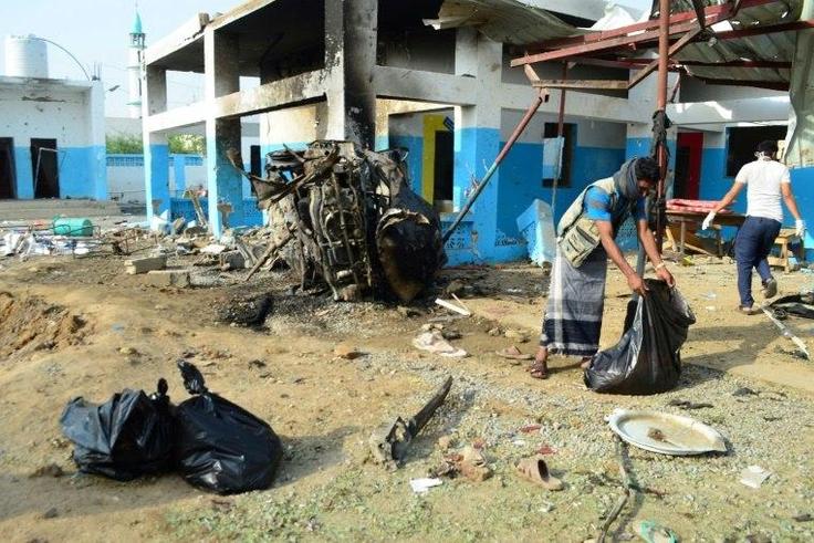 Yemeni workers clear debris at a hospital operated by the Doctors Without Borders on August 16, 2016 in Abs, a day after the hospital was hit by an air strike by the Saudi-led coalition