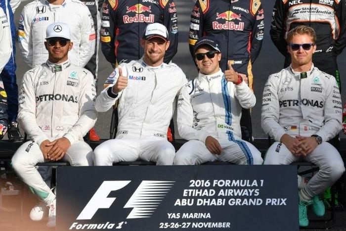 Mercedes AMG Petronas F1 Team's driver Lewis Hamilton (L), McLaren Honda's driver Jenson Button (C-L), Williams Martini Racing's driver Felipe Massa (C-R) and Mercedes AMG Petronas F1 Team's driver Nico Rosberg ahead of the Abu Dhabi Grand Prix