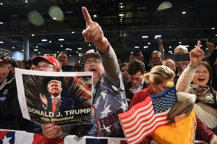 Supporters cheer as they watch President-Elect Donald Trump in Des Moines, Iowa on December 8, 2016