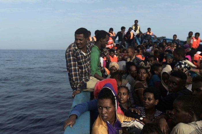 Refugees and migrants wait to be rescued by members of Proactiva Open Arms NGO in the Mediterranean Sea, some 12 nautical miles north of Libya