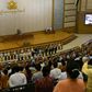 Myanmar ministers are sworn into office by Upper House Speaker Mahn Win Khine (on podium) during a ceremony at the parliament in Naypyidaw on March 30, 2016