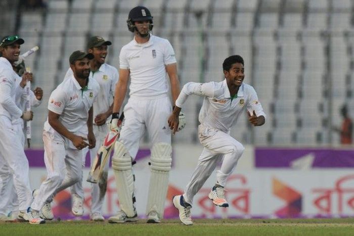 Bangladesh's Mehedi Hasan (R) celebrates with teammates after his side's victory on the third day of the second Test at the Sher-e-Bangla National Cricket Stadium in Dhaka on October 30, 2016