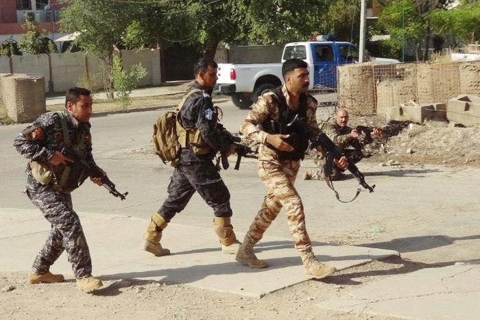 Iraqi Kurdish security forces patrol a street in the southern suburbs of Kirkuk after jihadist gunmen attacked the city, on October 22, 2016