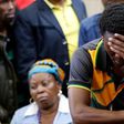 Victor Rethabile Mlotshwa reacts next to his mother after the appearance of Theo Martins and Willem Oosthuizen (not in picture), at the Middelburg magistrates high Court, in Mpumalanga province, South Africa, November 16, 2016. REUTERS/Siphiwe Sibeko