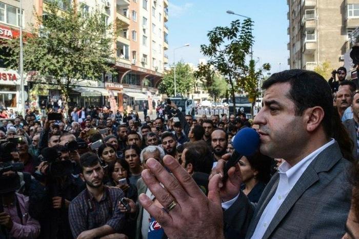 Turkish police have detained the two co-leaders of the country's main pro-Kurdish party, including Selahattin Demirtas (R), held at his home in Diyarbakir