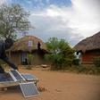 Robert Otala checks on solar panels that he uses for his home in Soroti District about 300 kilometres northeast of the capital Kampala