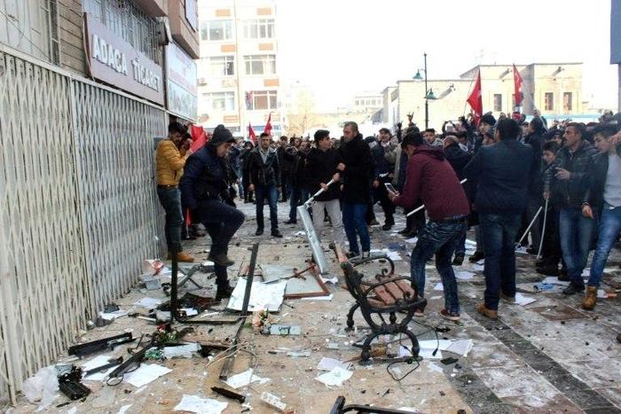 People protest in front of the offices of pro-Kurdish Peoples' Democratic Party following a suicide car bombing on December 17, 2016 in Kayseri