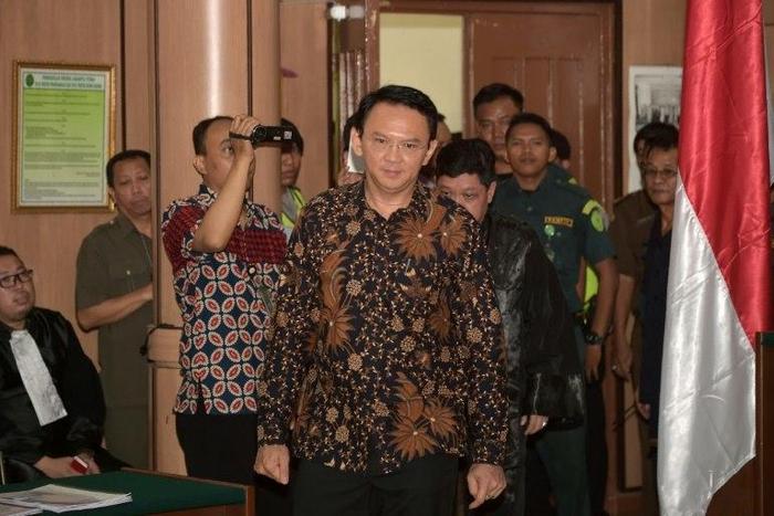 Jakarta's Christian governor Basuki Tjahaja Purnama (C) is on trial for blasphemy and faces a five-year prison sentence if convicted
