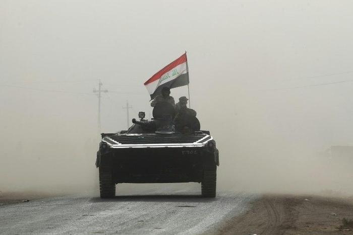 Iraqi forces enter the village of Abu Shuwayhah, south of Mosul, on November 1, 2016