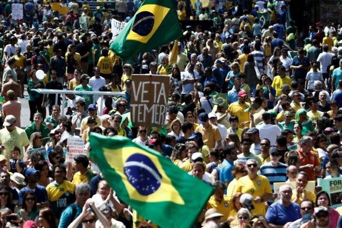 Demonstrators protest along Paulista Avenue in Sao Paulo, Brazil