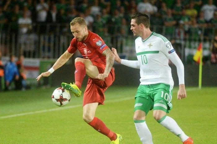 Michal Kadlec of Czech Republic (L) fights for the ball with Kyle Lafferty of Northern Ireland during their 2018 World Cup qualification match, in Prague, on September 4, 2015