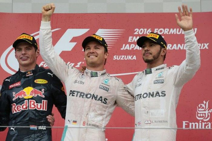 Nico Rosberg (C) roared to victory at Japan Grand Prix with Hamilton (R) trailing in third, stretching his lead to 33 points with only four races left this season