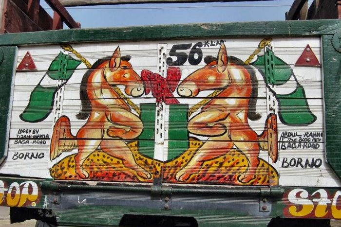 A drawing of the Nigerian coat of arms on a truck