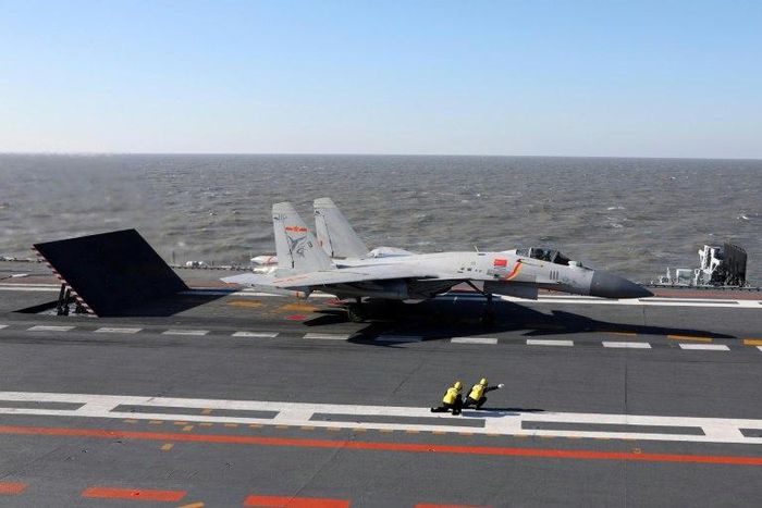 China's Liaoning aircraft carrier battle group has conducted its first live-fire exercises in drils involving dozens of ships