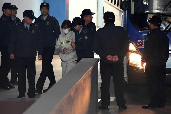 Choi Soon-Sil (C), at the centre of South Korea's corruption scandal, faces trial on charges of embezzlement and abuse of power