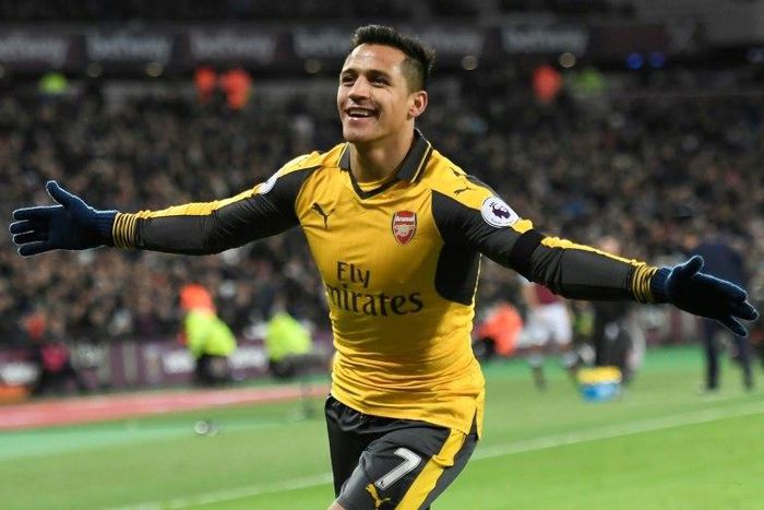 Arsenal's striker Alexis Sanchez celebrates after scoring their second goal during the English Premier League football match against West Ham United December 3, 2016