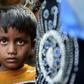 A young Rohingya girl who fled the violemce in Myanmar searches for her relatives at a refugee camp in Bangladesh