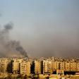 Smoke billows from the former rebel-held district of Bustan al-Qasr in Aleppo, on December 12, 2016