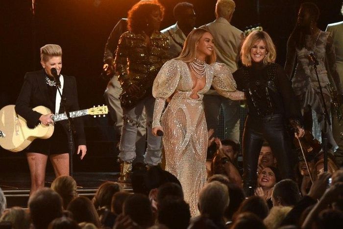 Beyonce performs onstage with Martie Maguire of Dixie Chicks at the 50th annual CMA Awards at the Bridgestone Arena in Nashville, Tennessee