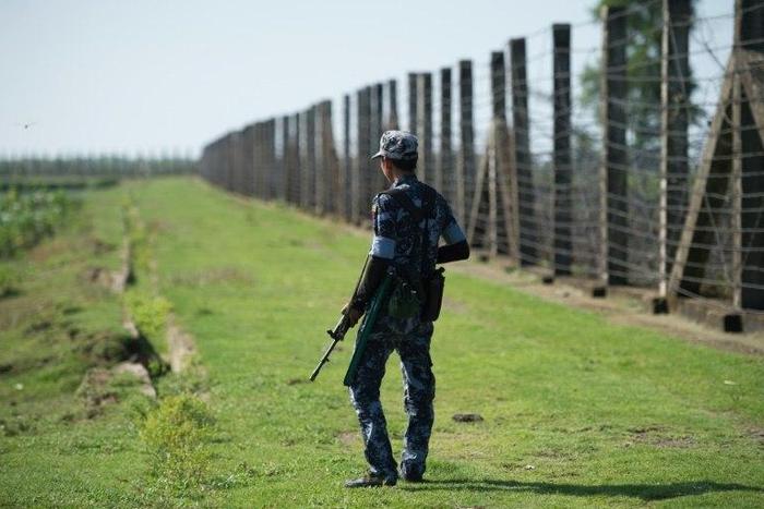 A military officer patrols the border fence along the river dividing Myanmar and Bangladesh located in Maungdaw, Rakhine State where there has been an upsurge of violence since October