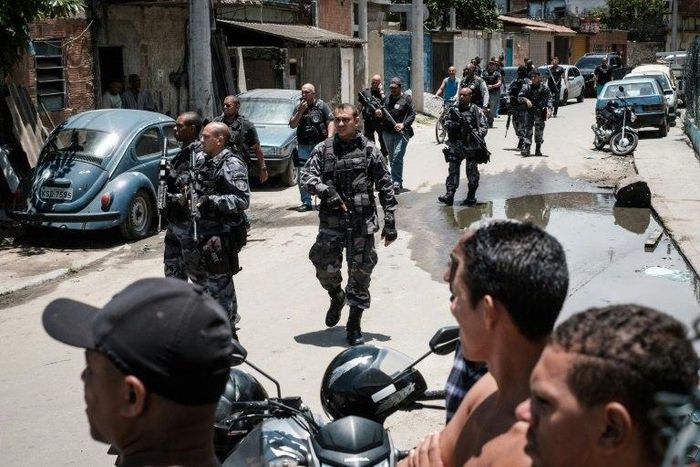Brazilian police officers patrol in the City of God favela in Rio de Janeiro, Brazil, on November 20, 2016