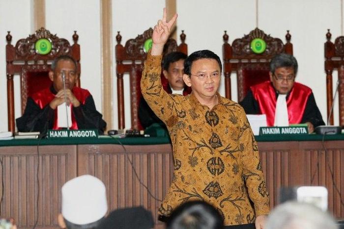 Jakarta's Christian governor Basuki Tjahaja Purnama (C), is on trial accused of blasphemy over remarks he made about the Koran while campaigning