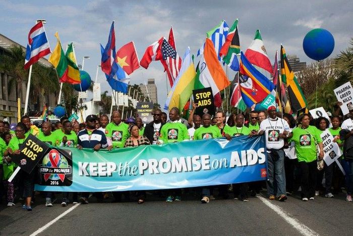 AIDS activists march through the streets of Durban on July 16, 2016