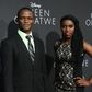 Robert Katende and Phiona Mutesi (R), whose life on which the story is based, pose on arrival for the premiere of Disney's "Queen of Katwe" in Hollywood, California on September 20, 2016