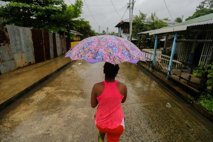 A Nicaraguan resident walks along the "El Canal" neighbourhood before Hurricane Otto barreled through the region on November 24, 2016