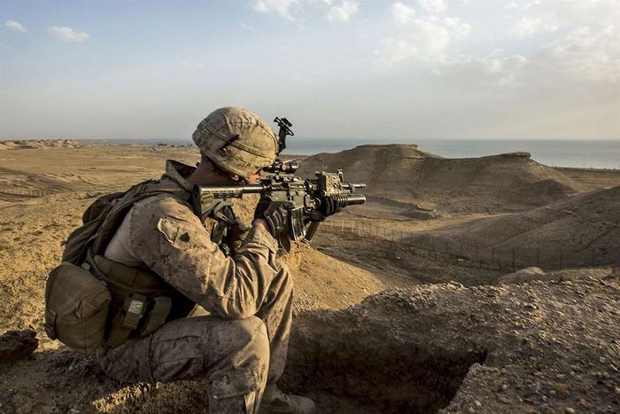 Marine Corps Sgt. Josh Greathouse scans the area during a perimeter patrol in Taqaddum, Iraq, March 21, 2016. Greathouse is a team leader assigned to Bravo Company, 1st Battalion, 7th Marine Regiment, Special Purpose Marine Air Ground Task Force Crisis...