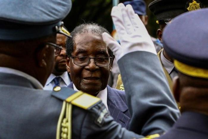 Zimbabwe President Robert Mugabe arrives to deliver the state-of-the nation address in Harare, on December 6, 2016