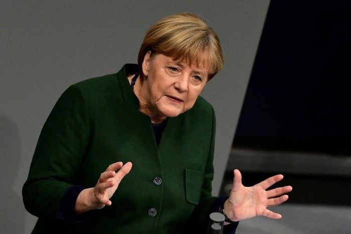German Chancellor Angela Merkel gestures as she gives a speech during a session at the Bundestag in Berlin, on November 23, 2016