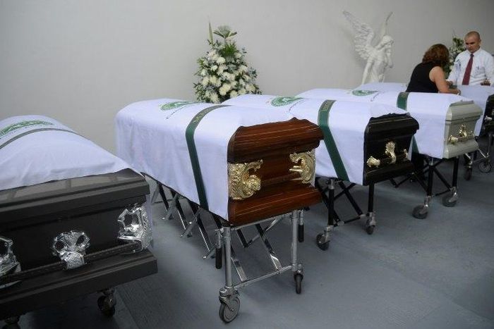 Coffins of members of the Brazilian football team Chapecoense Real the were killed in a plane crash in the Colombian mountains, are seen at the San Vicente mortuary in Medellin on December 1, 2016