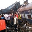 Indian rescue workers search for survivors in the wreckage of a train that derailed near Pukhrayan in Kanpur district on November 20, 2016