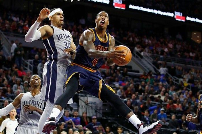 Iman Shumpert of the Cleveland Cavaliers looks to get a shot off around Tobias Harris of the Detroit Pistons during the second half, at the Palace of Auburn Hills in Michigan, on December 26, 2016