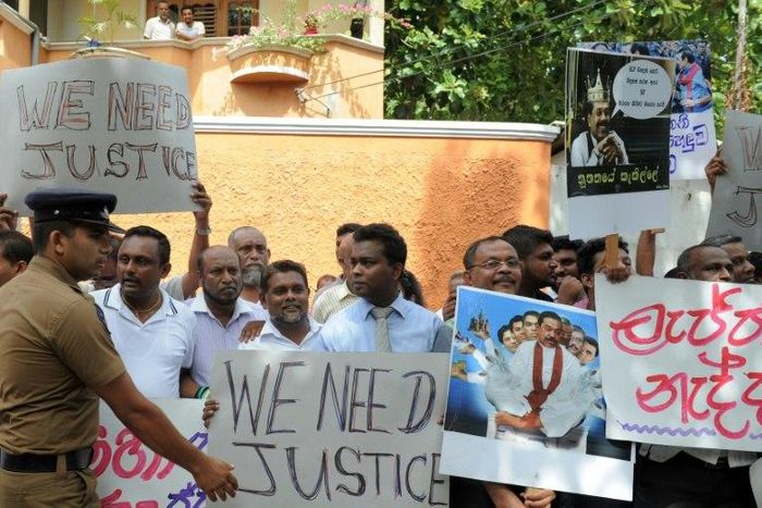 Activists protest against the government as the remains of Sri Lankan rugby player Wasim Thajudeen are exhumed and taken from Dehiwela mosque in Colombo the Judicial Medical Officer in August 2015