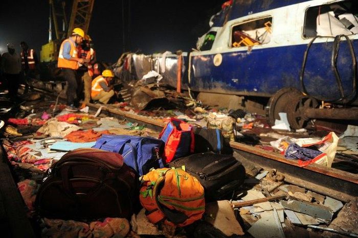 Rescue workers search for survivors in the wreckage of a derailed train near Pukhrayan in Kanpur district, northern India on November 20, 2016