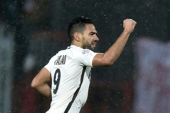 Monaco's Colombian forward Radamel Falcao raises his fist as he celebrates after scoring during the French L1 football match between Lorient and Monaco on November 18, 2016 at the Moustoir stadium of Lorient, western France