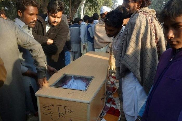 Pakistani Christians carry a coffin for one of the victims who was killed by toxic liquor, during his funeral in Toba Tek Singh, central Pakistan, on December 27, 2016