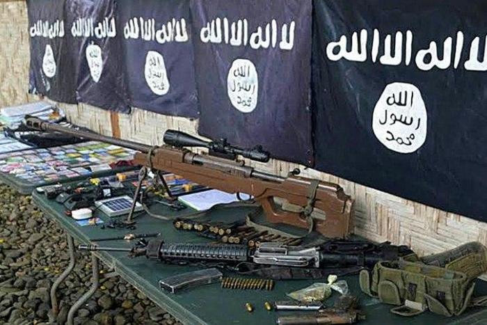 Weapons and IS flags recovered from members of Ansarul Khilafa in November, 2015 -- the group is one of several violent Islamic militant groups in the southern Philippines